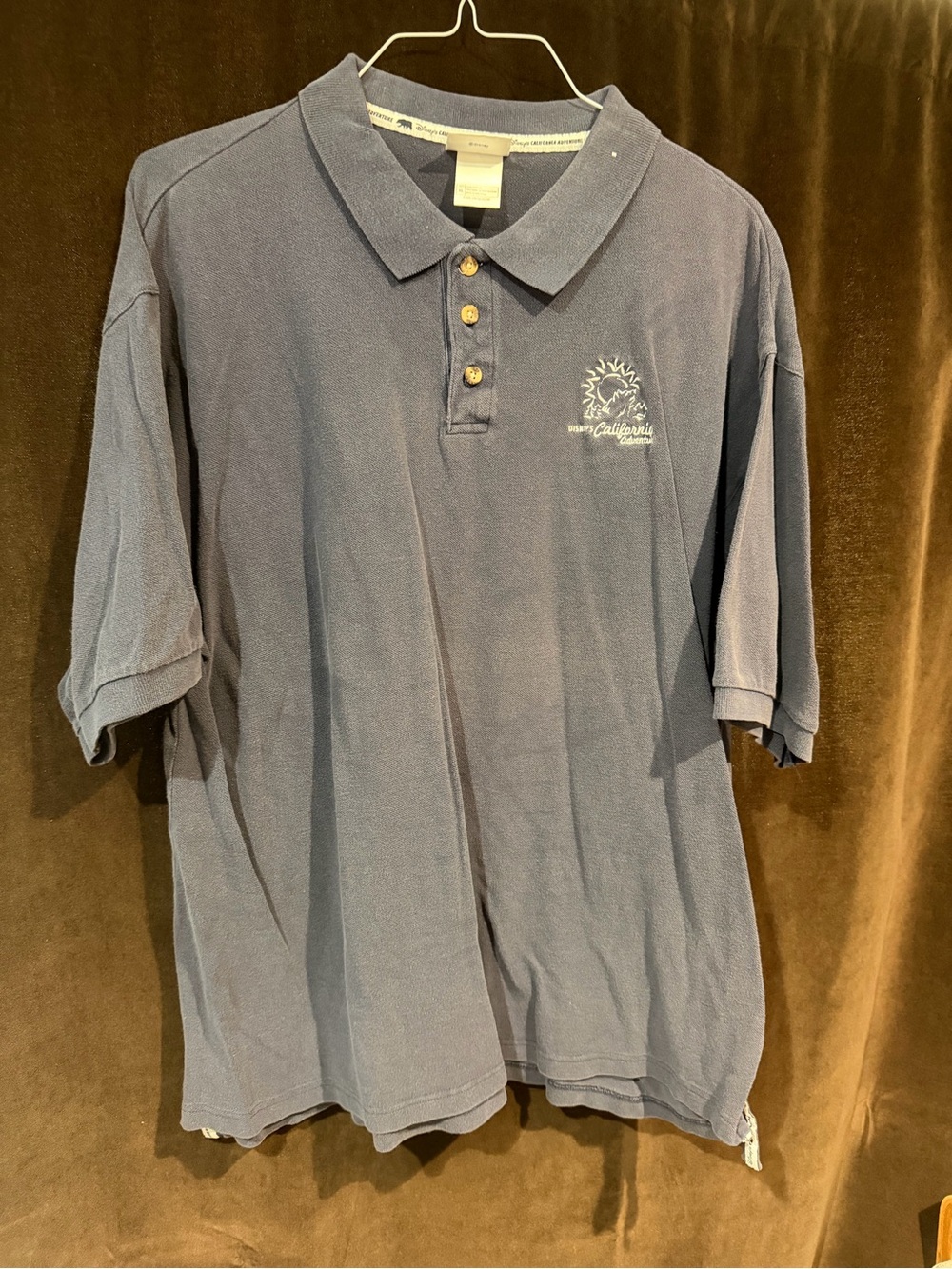 Disney Men's Dark Blue Polo with Embroidered Sun Detail